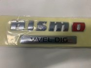 Nissan Patrol Y62 2010–2024 Nismo emblem foto 1