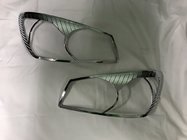 Kia Cerato 1 2004–2009 Krom forlygterammer (2 stk., plast) foto 1