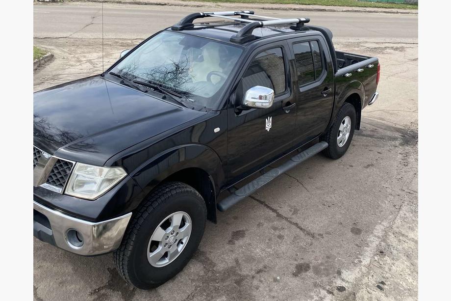 Nissan Navara 2006–2015 Tagrælinger med tværstænger (2 stk., krom) Image
